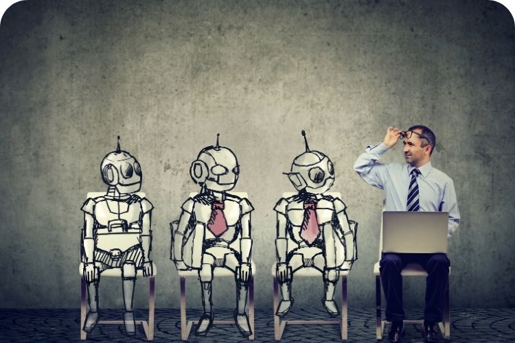 Business man is looking at robots sitting next to him.
