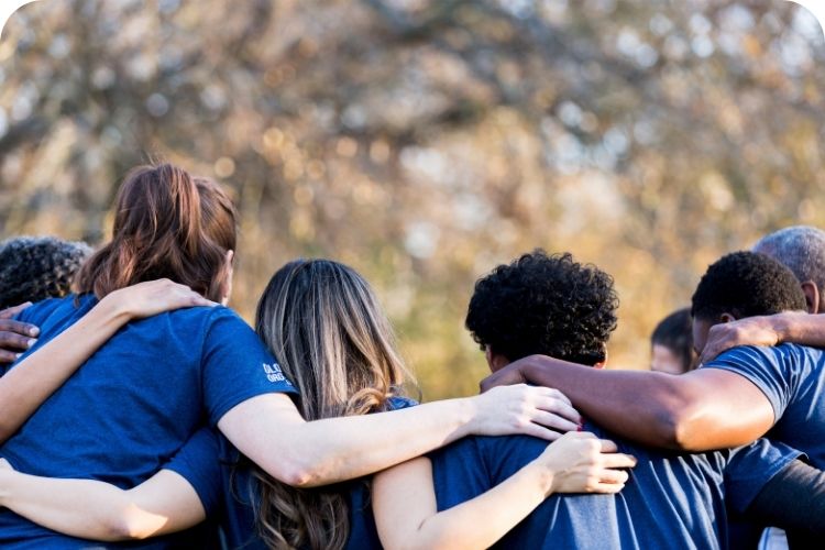 A group huddle for volunteers.