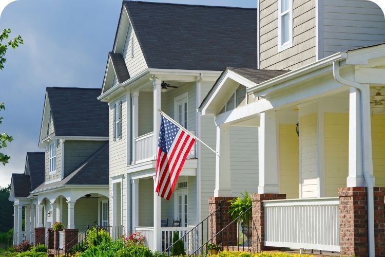 Yellow house with an American flag.