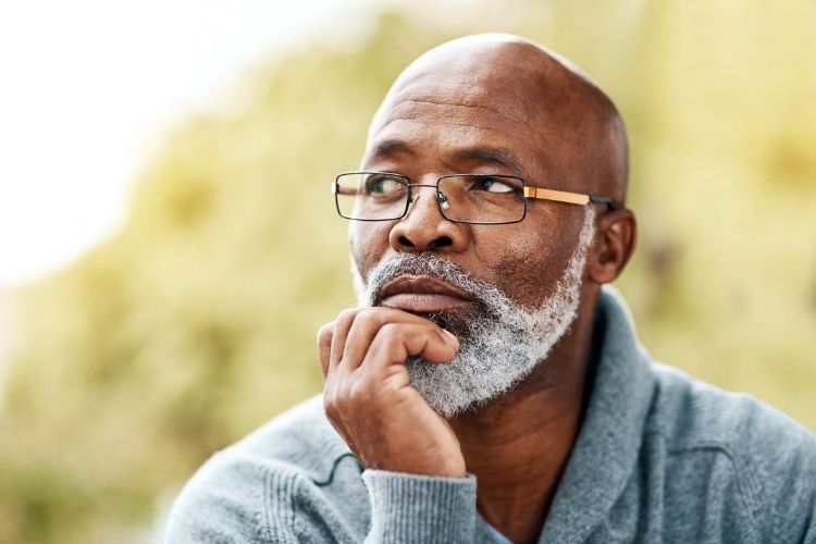 Man looking slightly upward while thinking.