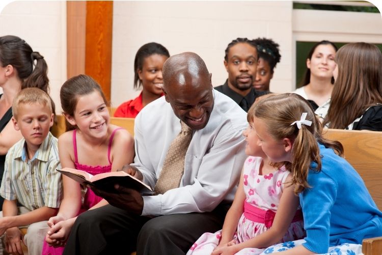 A pastor teaching kids at a church.