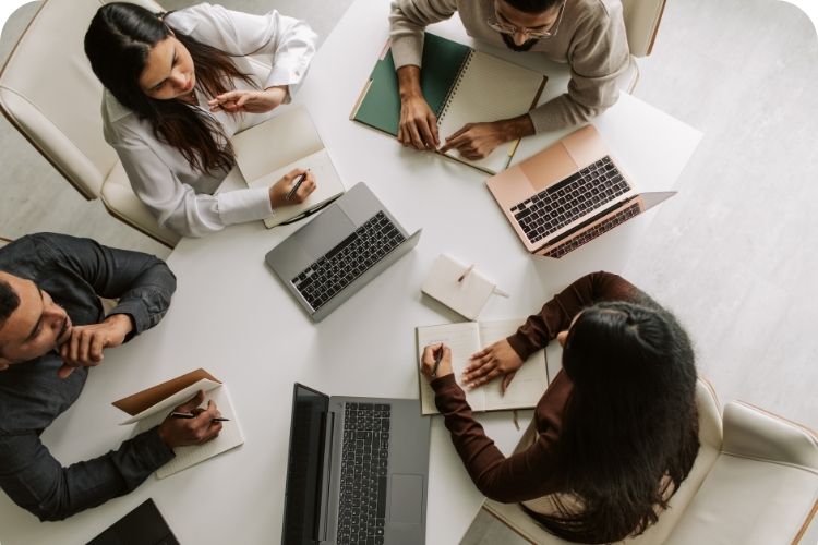 A team meeting together to discuss a project.