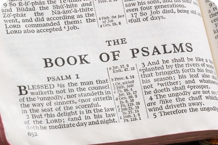 The Bible opened to the Book of Psalms.