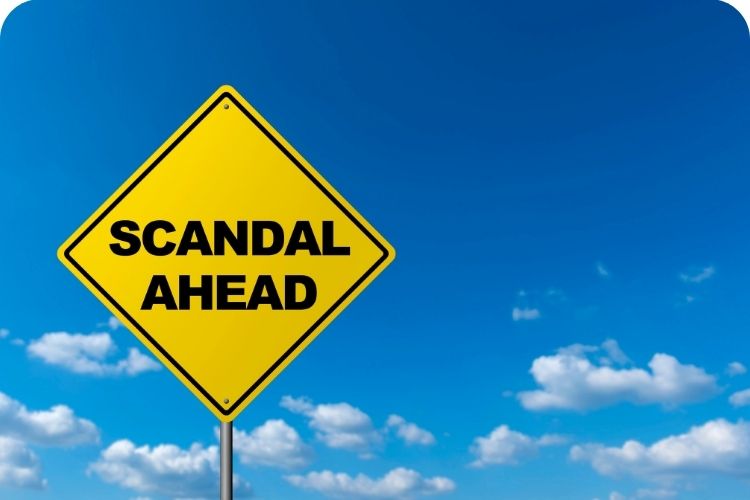 A warning sign that says "Scandal Ahead."