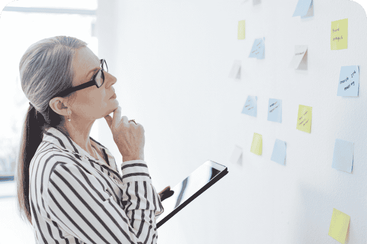 An older woman planning her business strategy.