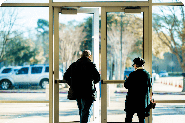 A man leaving an office building.