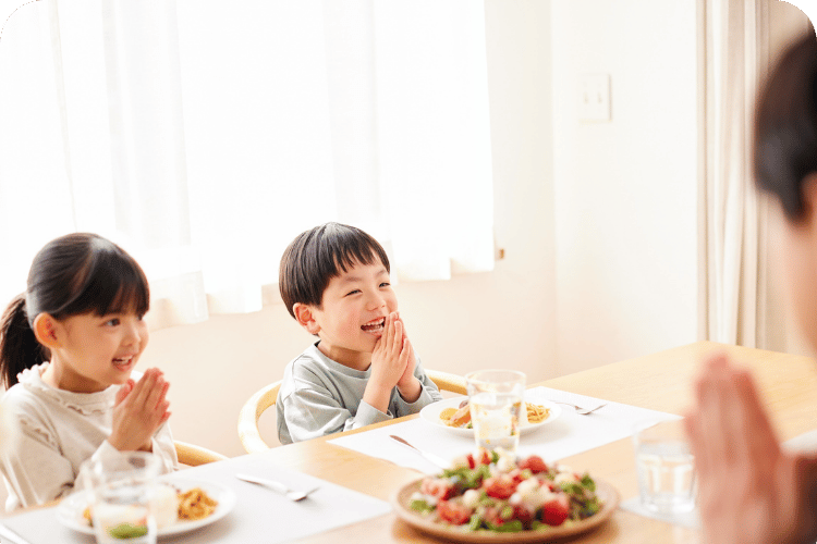 A family praying before eating.