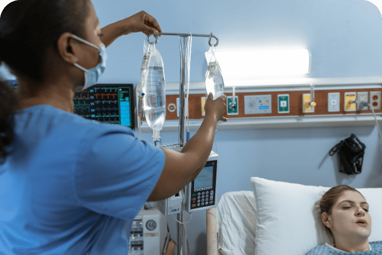 A nurse helping a patient.
