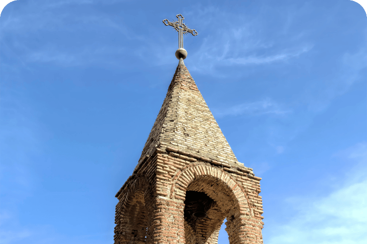 A stone church steeple.