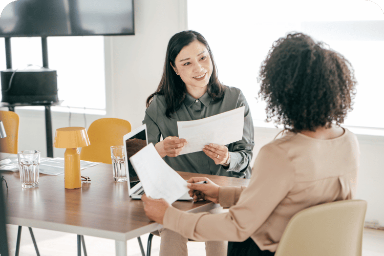 A leader asking questions to an employee.